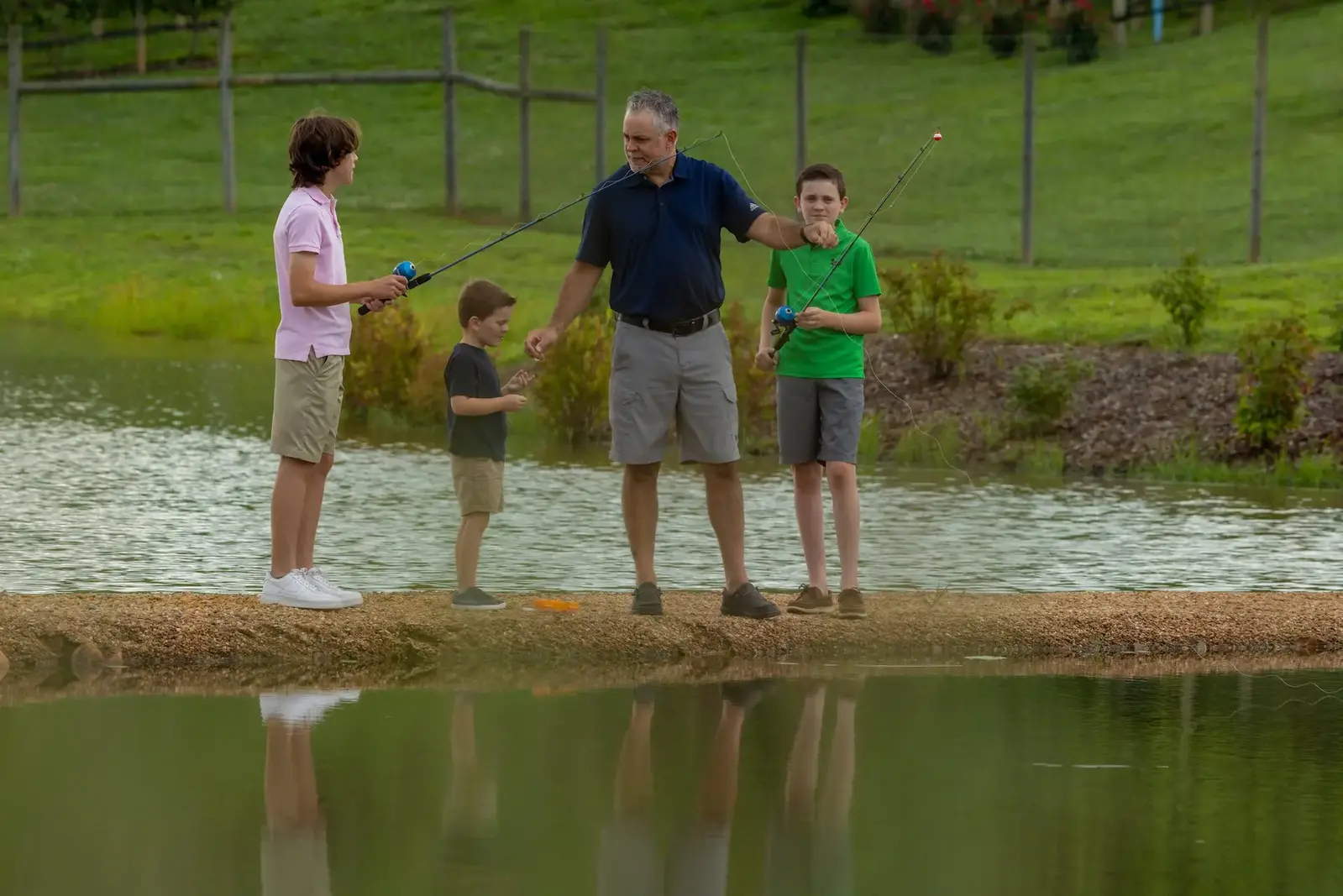 father and sons fishing