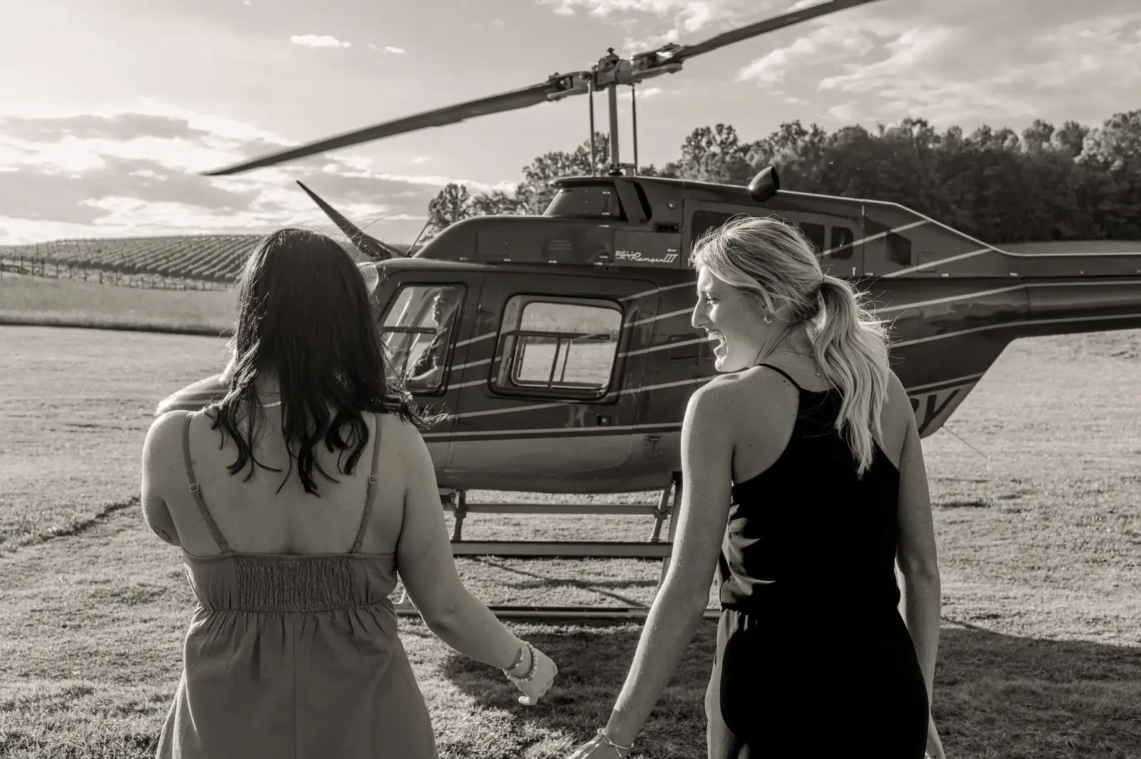 women walking toward helicopter