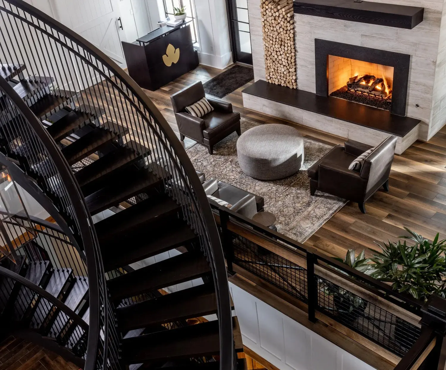 lobby with fireplace and staircase