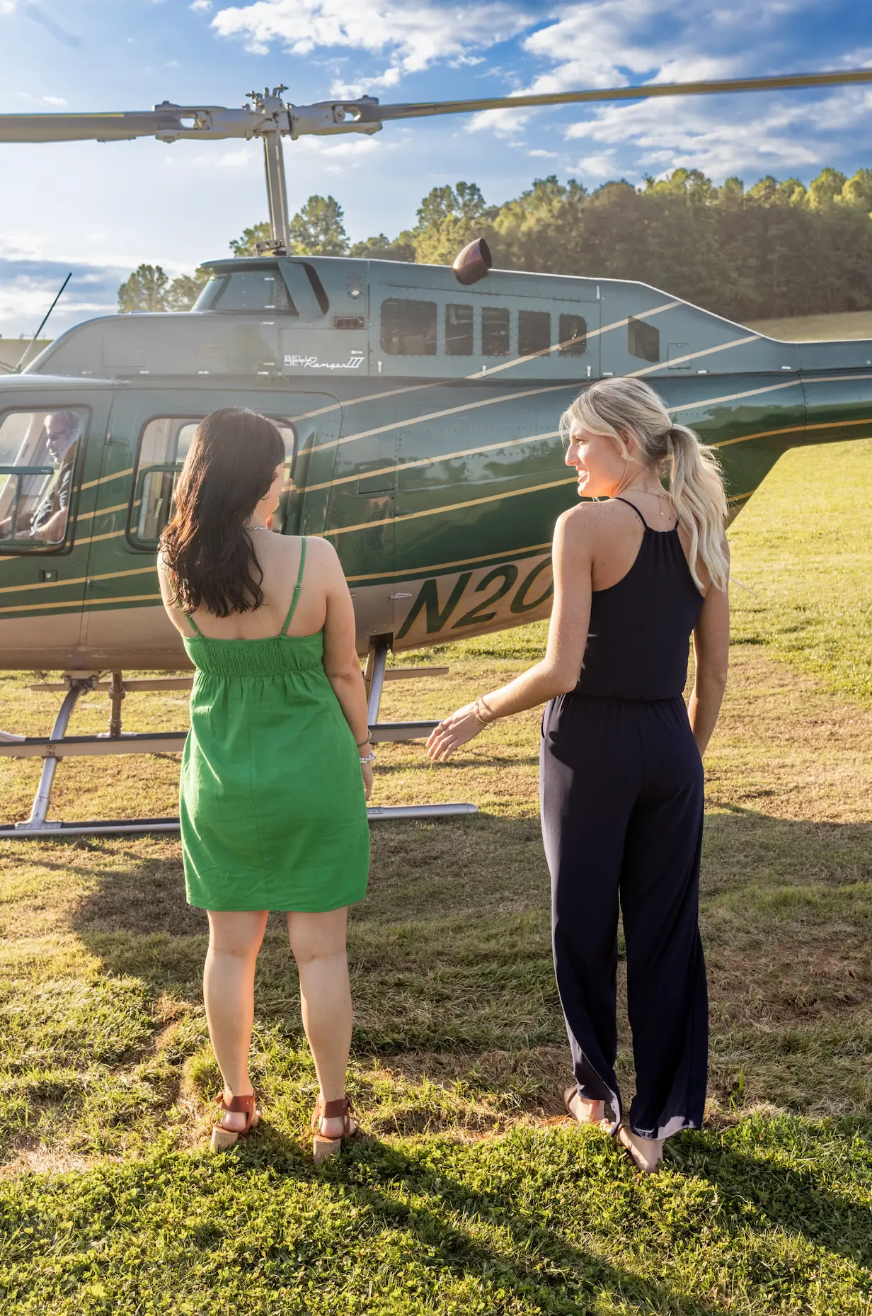 women walking toward helicopter