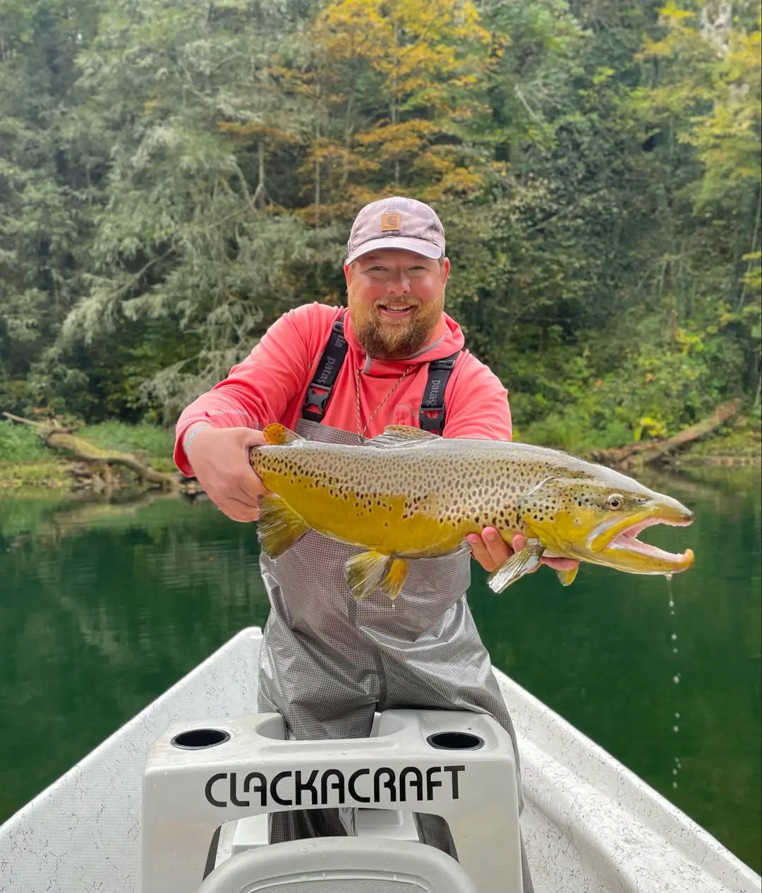 man on boat with large fish