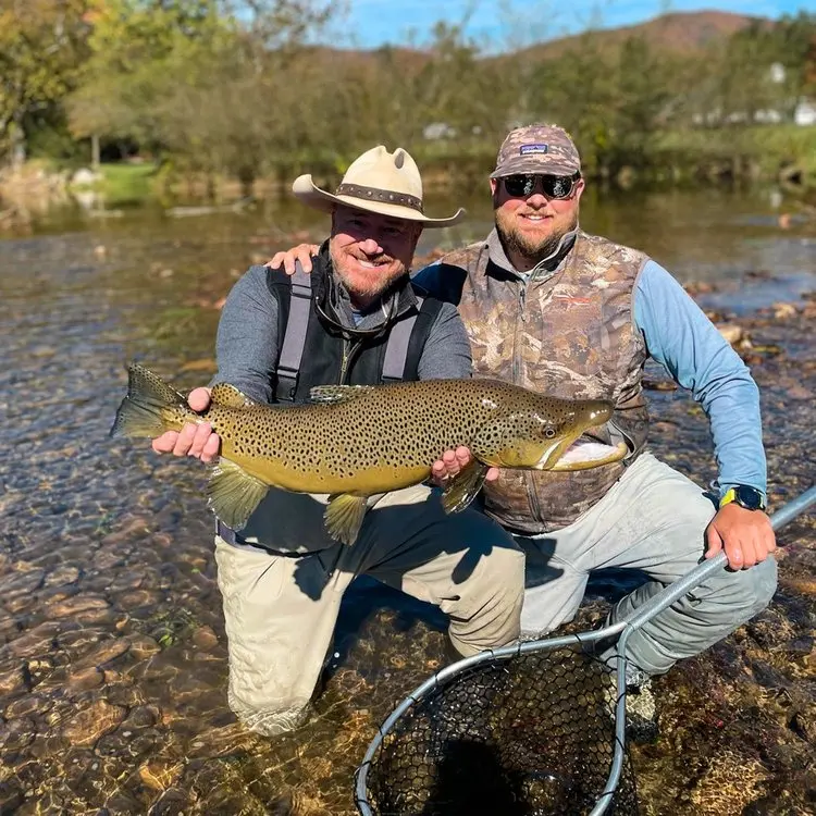 men posing with fish