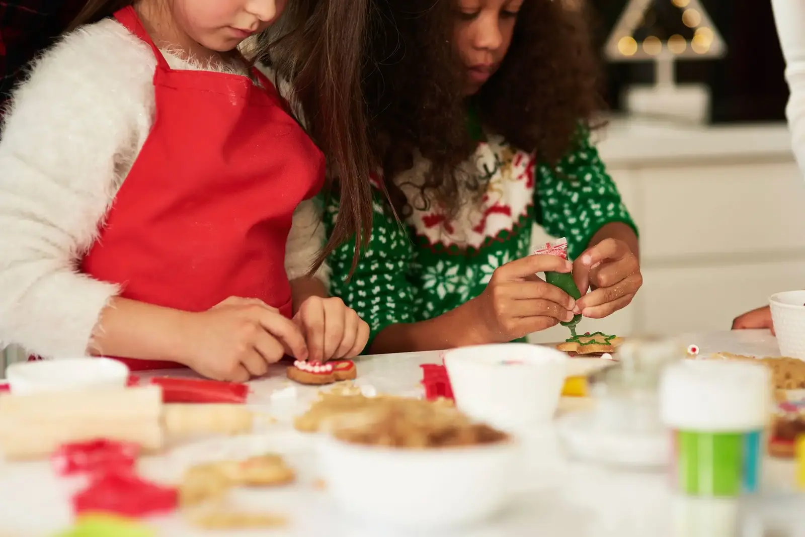 two-girls-decorating-christmas-cookies