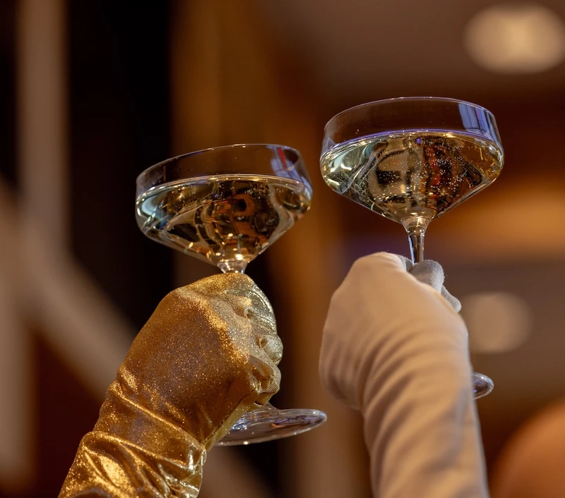 two glasses clinking on New Year's Eve